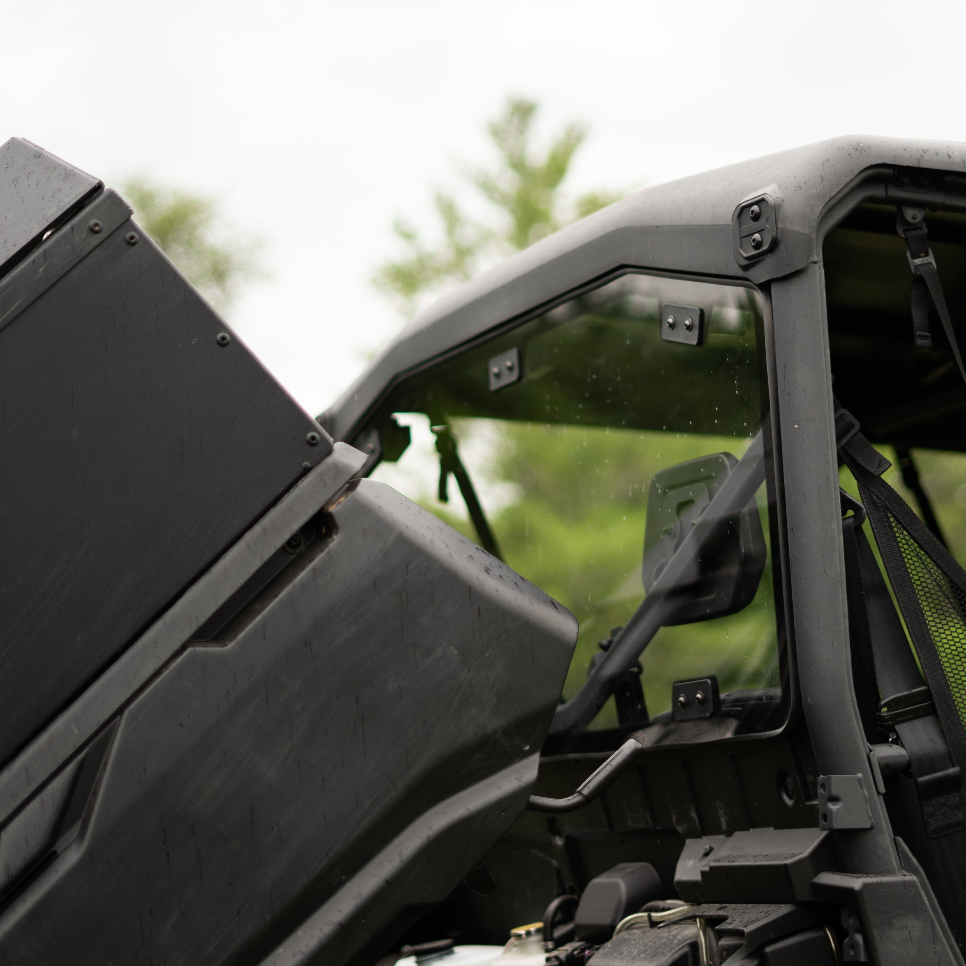 Close-up of a black off-road vehicle with a clear sky background