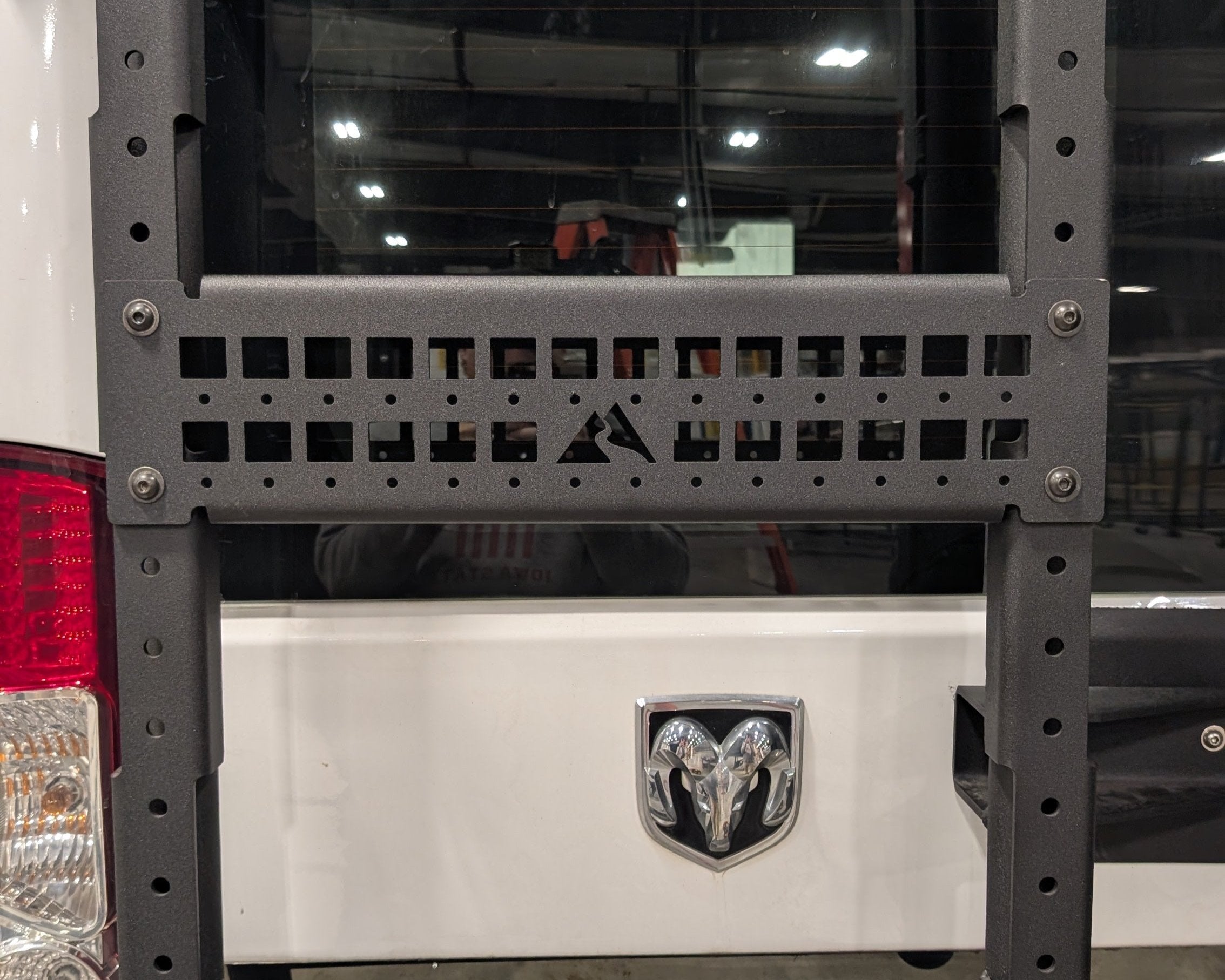 Black River Mullet Molle Plate mounted on a van rear door for modular gear organization and storage