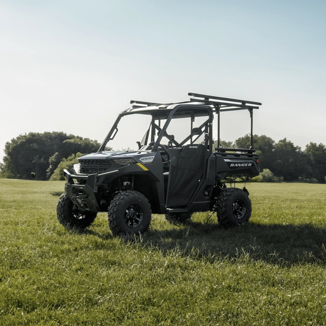 UTV with utility rack and other UTV accessories in a grassy field